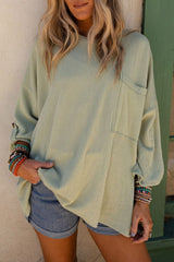 Green ribbed oversized top with rolled up sleeves and chest pocket
