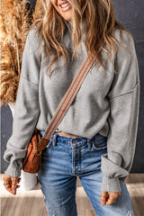 Grey turtleneck knit sweater with dropped shoulders and bubble sleeves
