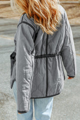 Quilted jacket with tightening cord and gray stitching