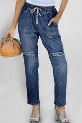 Pantalon de jogging en denim à poches rondes et vieilli bleu foncé