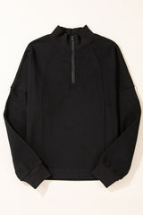 Sudadera negra con cuello con cremallera y hombros caídos