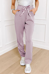 High waist pants with tightening cord and orchid petals, satin striped patch, right leg