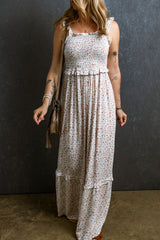 Long floral dress gathered with straps and white lace ruffles