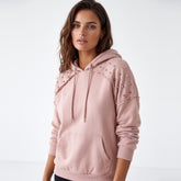 Sweat à capuche rose à manches raglan et rivets décoratifs