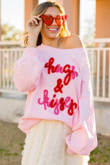 Sudadera rosa con manga raglán abrazos y besos bordados
