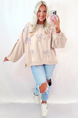 Oversized sweatshirt with lantern sleeves and parchment embroidered bow