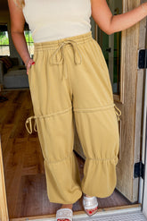 Beige high waisted drawstring fitted band pants