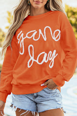 Sweat-shirt graphique à épaules tombantes et guirlandes orange russet Game Day