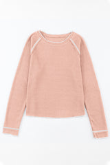 Long -sleeved textured high and apricot pink round pink neck *