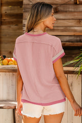 Light pink t-shirt with round neck and contrasting textured border
