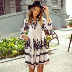 Beige V-neck mini dress with western pattern print tassels