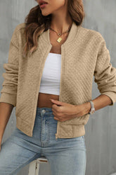 Pale khaki jacket with textured and geometric baseball collar