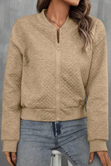 Pale khaki jacket with textured and geometric baseball collar