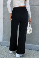 Pantalones casuales negros con tamaño con cordón apretado y forro de lana unido