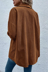 Textured brown jacket with flap pockets and drooping shoulders