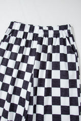 Grandes pantalones de cintura alta negras con baldosas de dos colores *