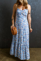 Long frowned dress with ruffles and blue floral sky print
