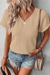 T-shirt with rolled up sleeve and knitted knitting with oat
