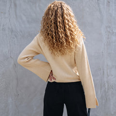 Pull ample en tricot texturé uni parchemin avec poignets fendus*