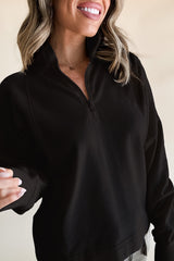 Black zip-up sweatshirt with dropped shoulders