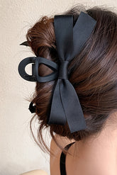 Large hair clip with black knot decor
