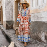 Vestido largo naranja con mangas largas y estampado geométrico boho