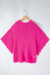Pull fuchsia en maille ajourée à bords festonnés