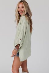 Green ribbed oversized top with rolled up sleeves and chest pocket