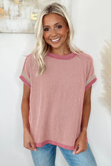 Light pink t-shirt with round neck and contrasting textured border