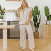 High zipped textured with ruffle sleeves *