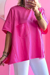 Oversize t-shirt in bright pink with plated pocket and apparent seams