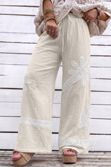 Pantalon large blanc en coton à dentelle florale