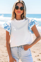 Chemisier blanc brodé à manches volantées et col à volants