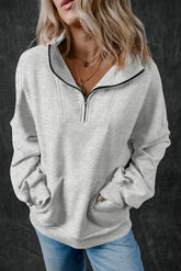 Light gray zipped sweatshirt with high collar and kangaroo pocket