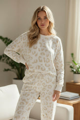Living room set with white leopard sweater and tightening cord pants