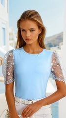 Haut ras du cou à manches bouffantes *