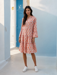 Orange mini-shelter with floral print and ruffle sleeves *