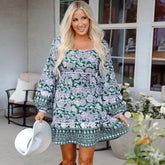 Green dress with floral print and border *