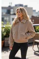 Light beige winter fluffy jacket with pockets and zipper