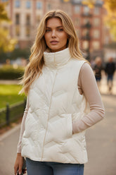 White quilted jacket with high collar and zipper