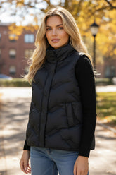Black quilted jacket with high collar and zipper