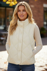 Beige quilted vest coat with high collar and buttoned pocket