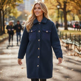 Blue teddy coat with simple buttoning and contrasting flap pocket