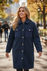 Blue teddy coat with simple buttoning and contrasting flap pocket