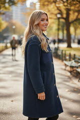 Blue teddy coat with simple buttoning and contrasting flap pocket