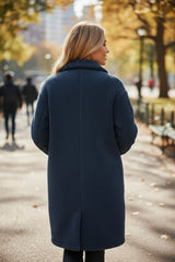 Blue teddy coat with simple buttoning and contrasting flap pocket