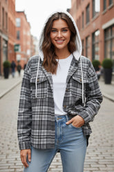 Loose-fitting jacket with contrasting hood and flap pockets in black plaid print