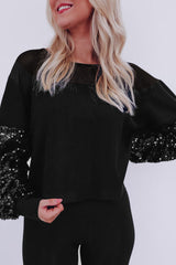 Blouse noire à manches lanternes et patchwork de sequins-A WOMAN WE LOVE
