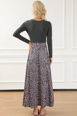 Long black leopard dress with adjusted bodice and long sleeves