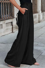 Pantalones elegantes plisados negros